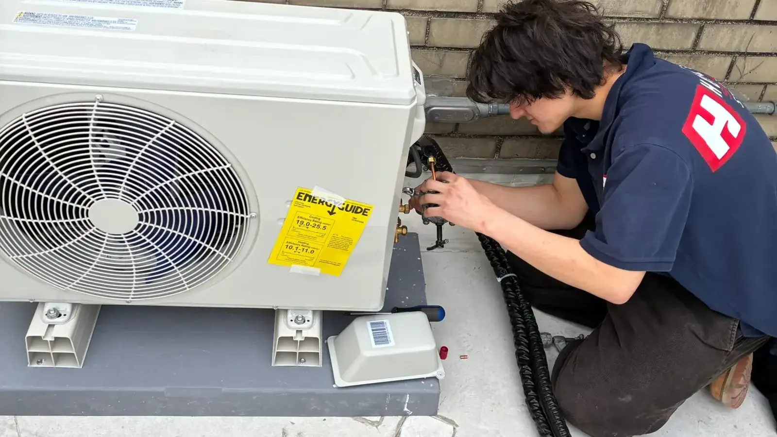 Hot & Cool Services HVAC project team at a local property