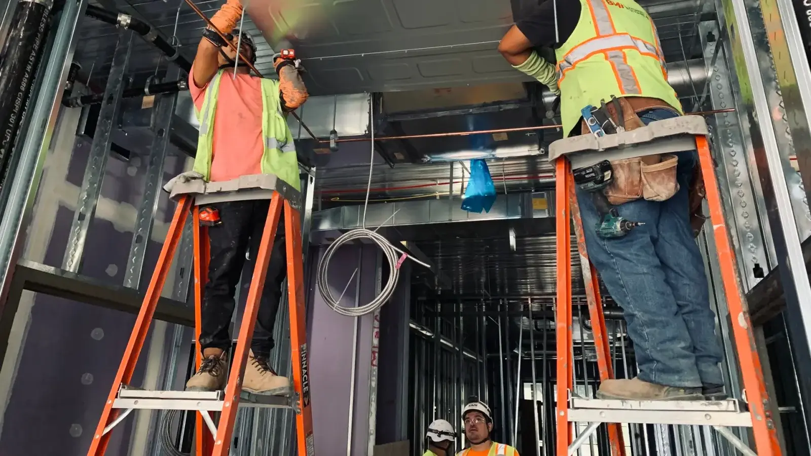 HVAC technicians working on heating and cooling equipment