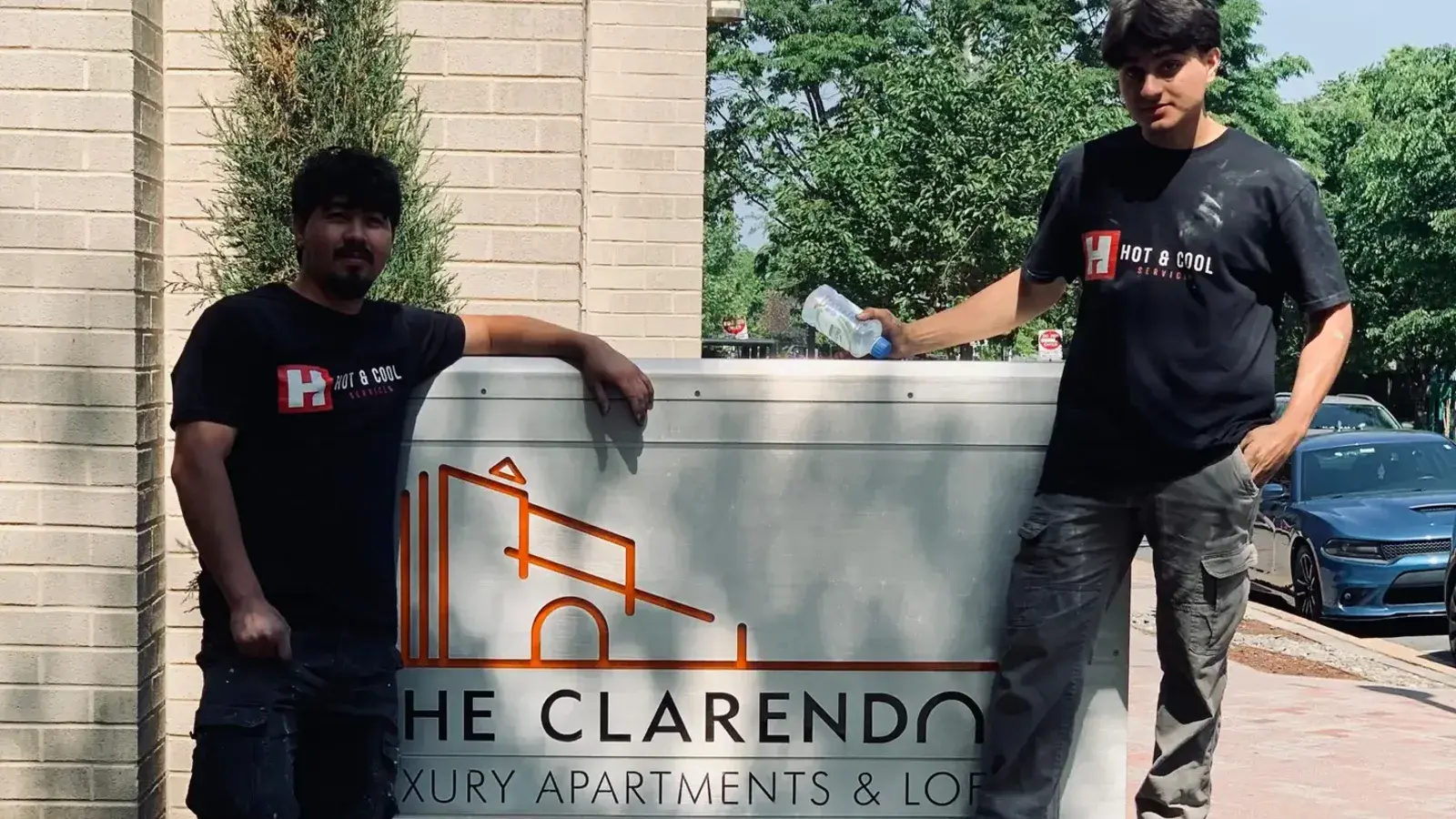 Hot & Cool Services technicians completing property HVAC work
